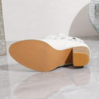 Adèle – Santiags blanches ajourées cuir, détails cloutés